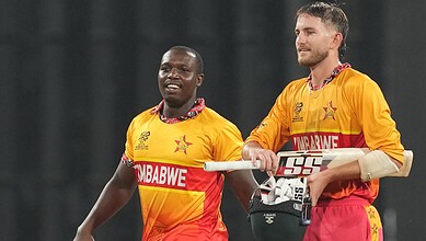 Zimbabwe cricket players celebrating after winning match against Sri Lanka in T20 World Cup.