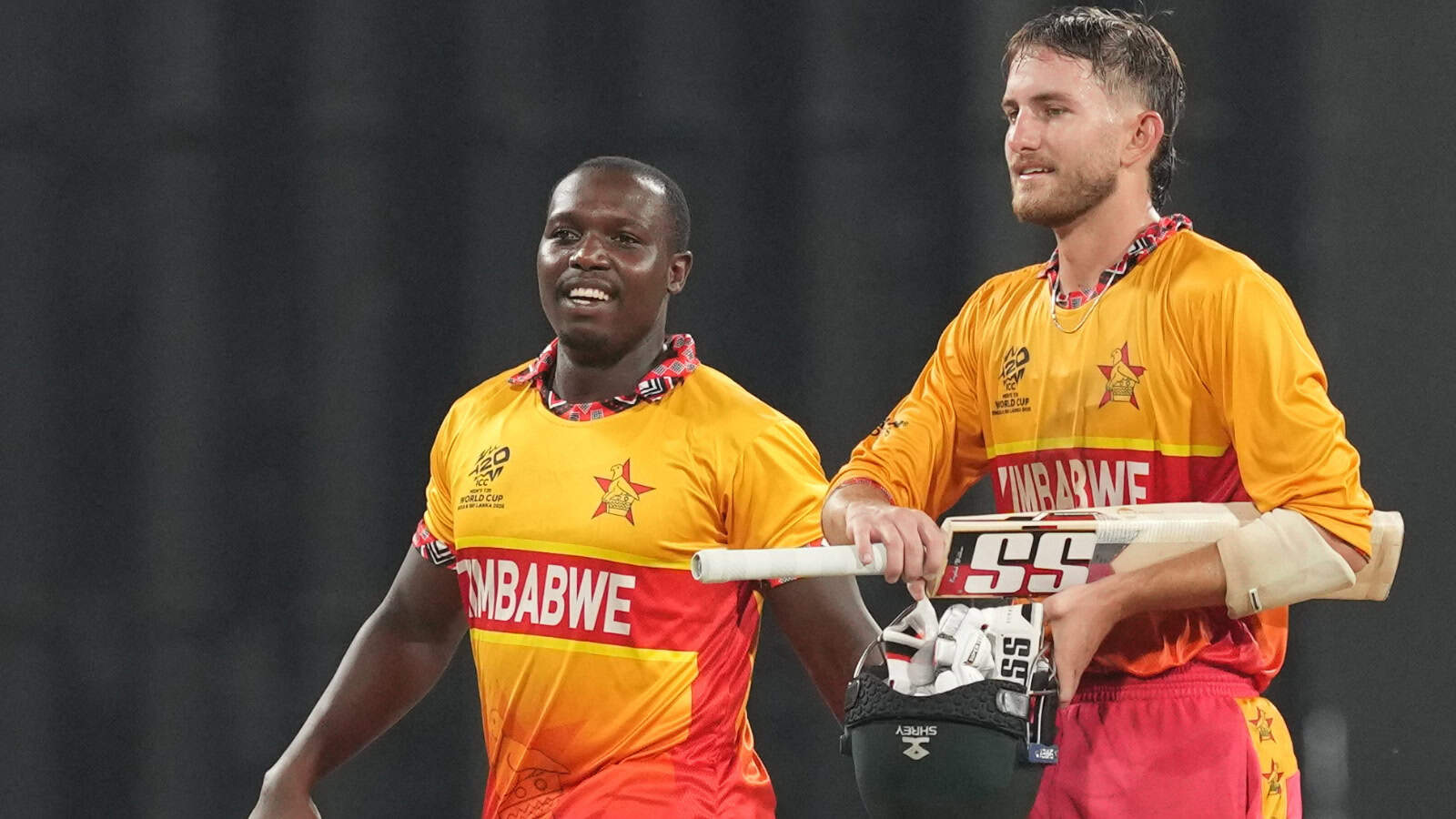 Zimbabwe cricket players celebrating after winning match against Sri Lanka in T20 World Cup.