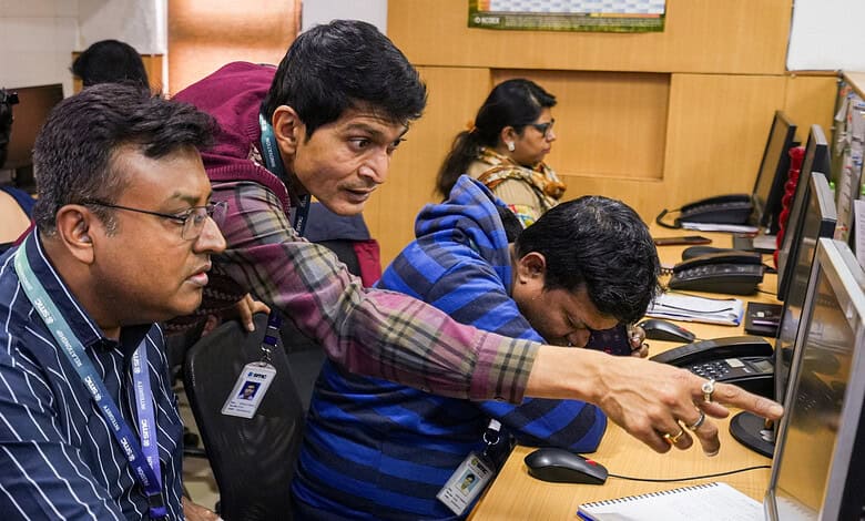 Traders react after fluctuations in stock market, in Kolkata, Sunday, Feb. 1, 2026.