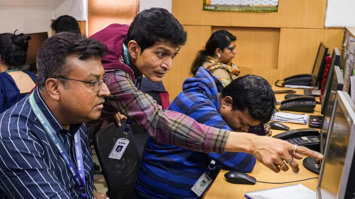 Traders react after fluctuations in stock market, in Kolkata, Sunday, Feb. 1, 2026.