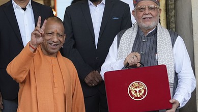 Indian Prime Minister with officials at budget event, showcasing government infrastructure plans.