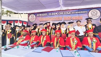 Students of Anwar-ul- Uloom College pose with their medals at the graduation ceremony