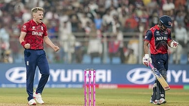 England's Sam Curran, left, celebrates as Nepal's Lokesh Bam, right, looks dejected after the former's team won an ICC Men's T20 World Cup 2026 cricket match between England and Nepal at the Wankhede Stadium, in Mumbai on Sunday. (PTI Photo/Shashank Parade)