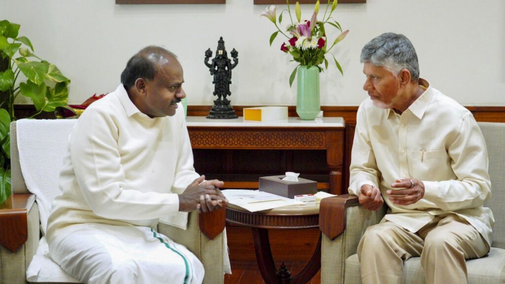 Naidu and official discuss Polavaram project funding in office.