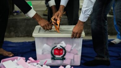 Bangladeshi polling officials open a ballot box for counting after the voting of national parliamentary election ended at a polling station in Bangladesh, on Thursday. AP/PTI
