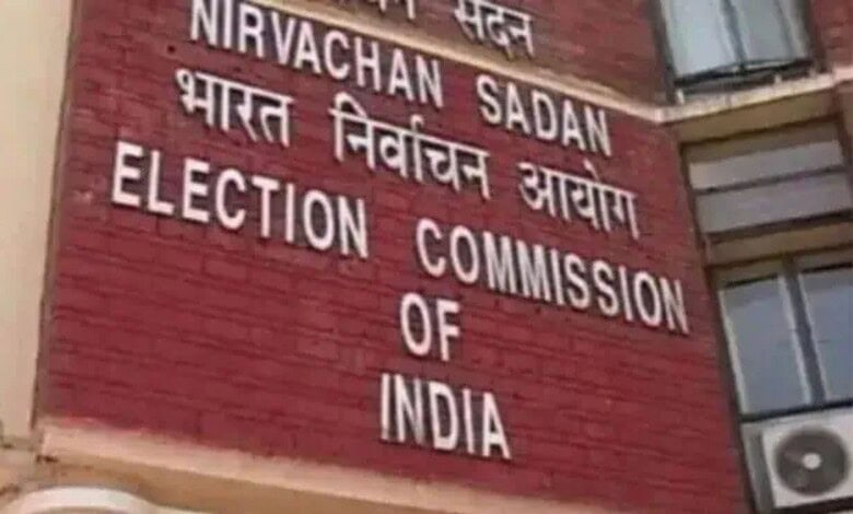 Election Commission of India sign on a brick wall.