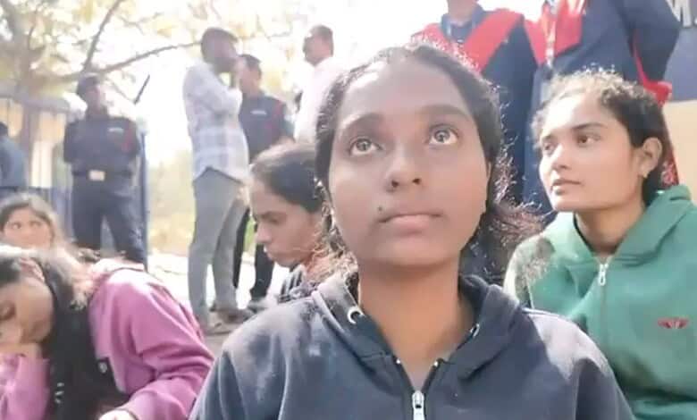 Students at Osmania University campus during a daytime event.