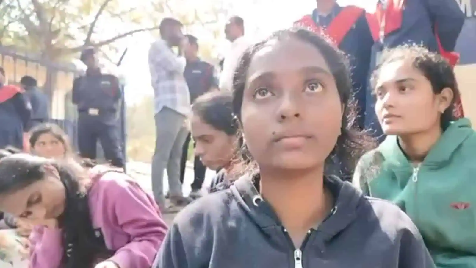 Students at Osmania University campus during a daytime event.