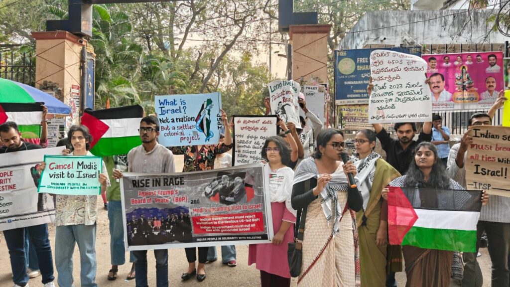Palestine activists demonstrate against Trump’s peace initiatives, holding banners and flags in a pu.