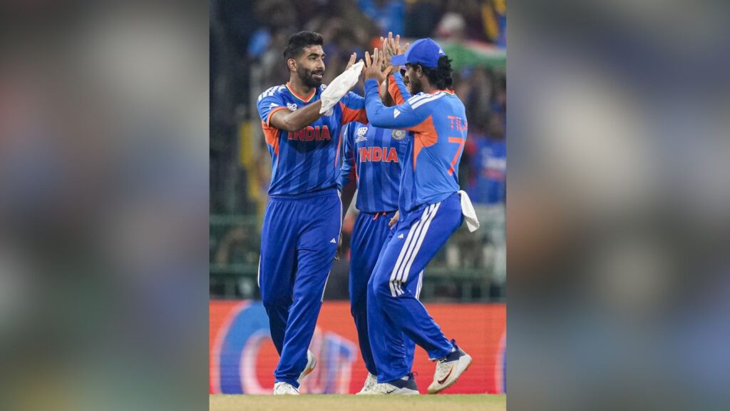 Indian cricket players celebrating on the field.