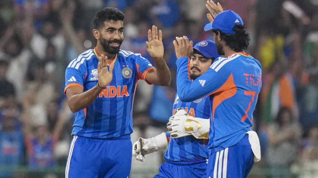 India cricket team celebrating after scoring during a match.