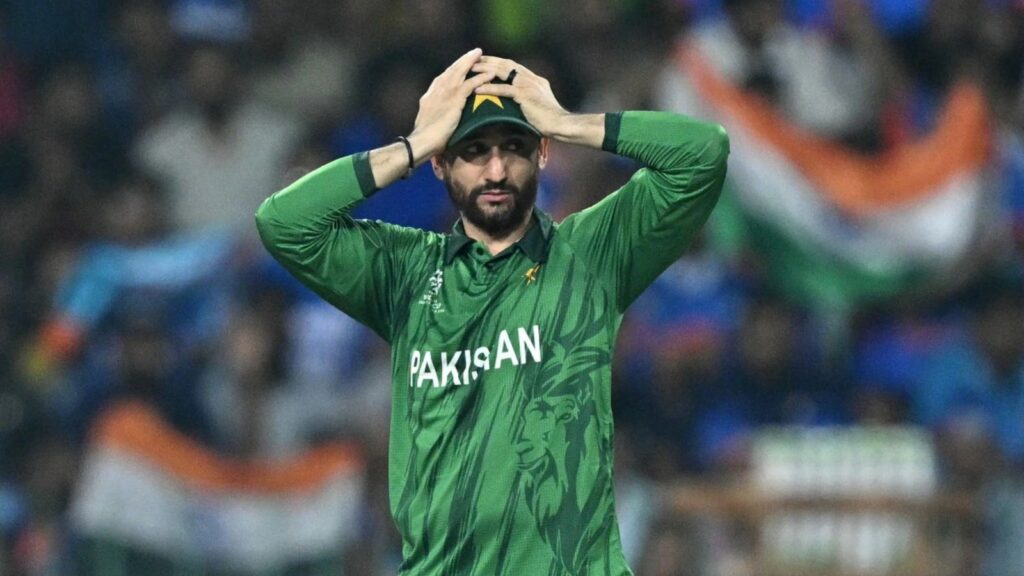 Pakistan cricket player with hands on head, showing disappointment.