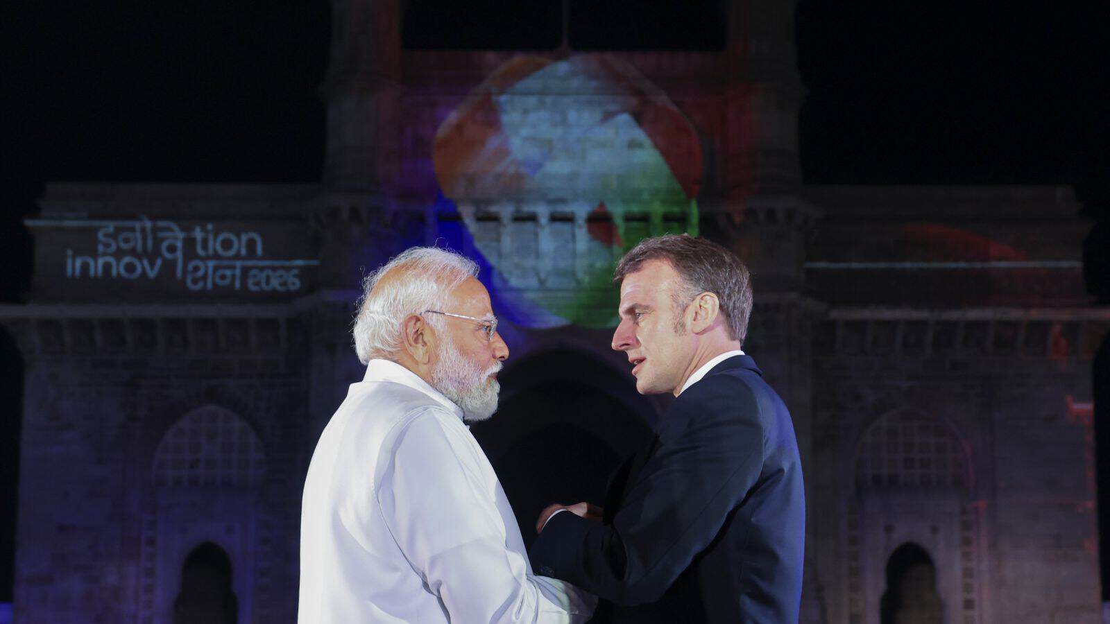 French President Macron meeting Indian officials in Mumbai during his visit.