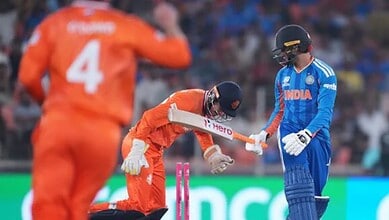 Indian cricket players celebrating victory after match against Netherlands.