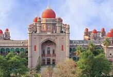 Telangana High Court with domed architecture and lush greenery.