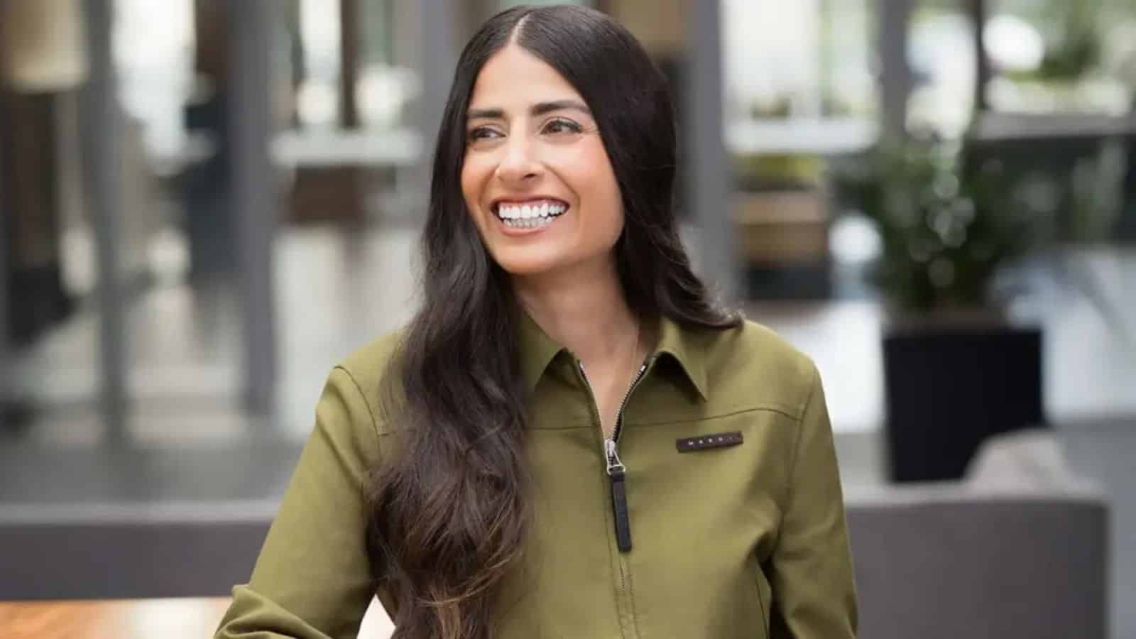 Asha Sharma, Indian-origin CEO of Microsoft Gaming, smiling in a modern office setting.