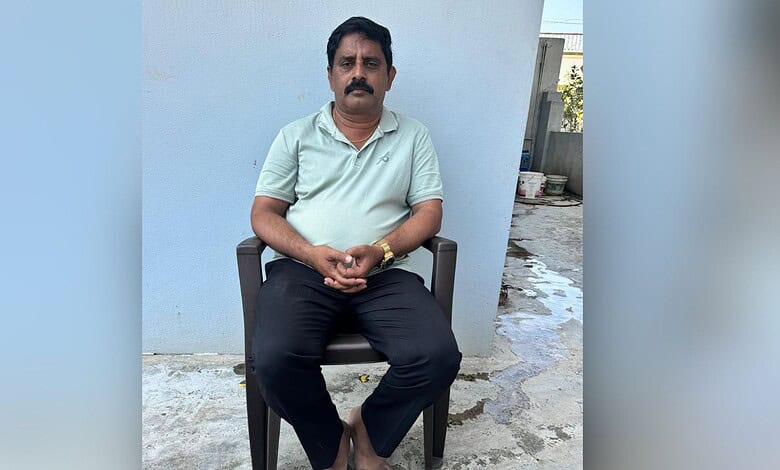 Man sitting outdoors in casual attire at The Siasat Daily office.