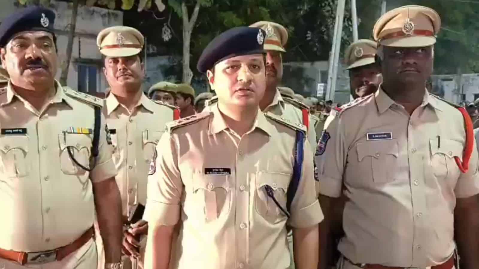 Police officers at Banswada addressing communal clash, maintaining law and order.