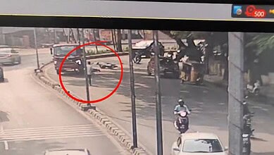 Accident scene in Hyderabad's Banjara Hills with vehicles and pedestrians after a road mishap.