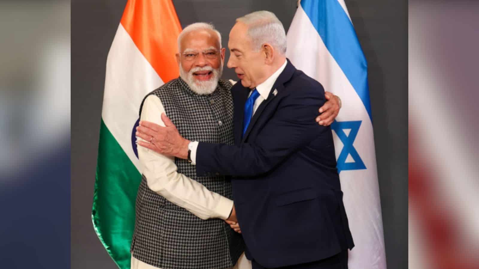 Indian Prime Minister Modi and Israeli Prime Minister Netanyahu sharing a warm handshake and smile during.