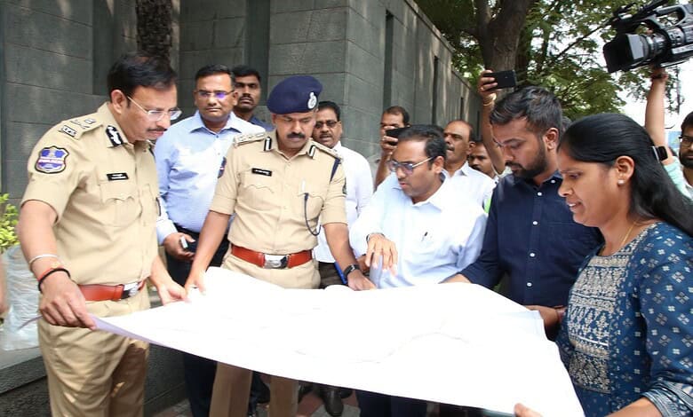 Hyderabad Comissioner of Police V C Sajjanar looks at the map of H-CITI project