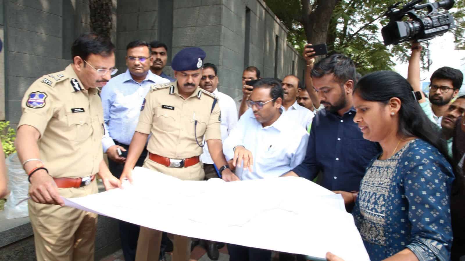 Hyderabad Comissioner of Police V C Sajjanar looks at the map of H-CITI project