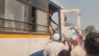 Passengers alight from a bus after an accident in Telangana
