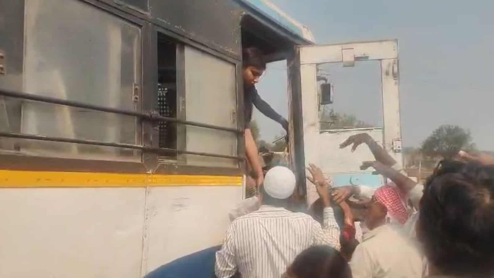 Passengers alight from a bus after an accident in Telangana