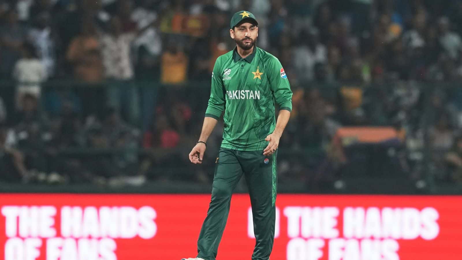 Pakistan cricket player in green uniform during T20 World Cup 2026 match.