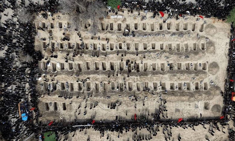 Aerial view of mourners at a cemetery in Iran during a memorial event.
