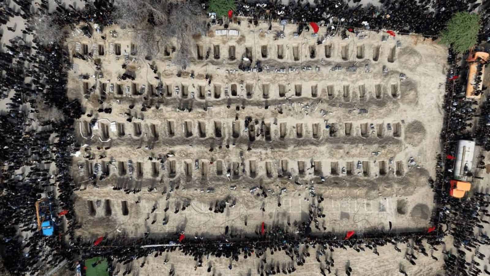 Aerial view of mourners at a cemetery in Iran during a memorial event.