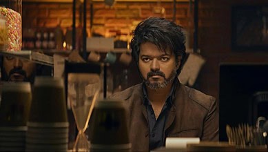 Vijay, the famous Tamil actor, appears in a dramatic scene, reflecting his intense expression and stylish.