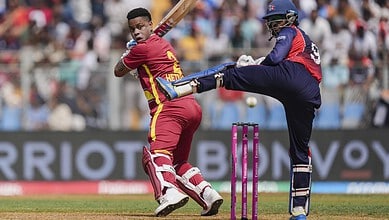 West Indies batter facing a fast bowler during T20 World Cup game.