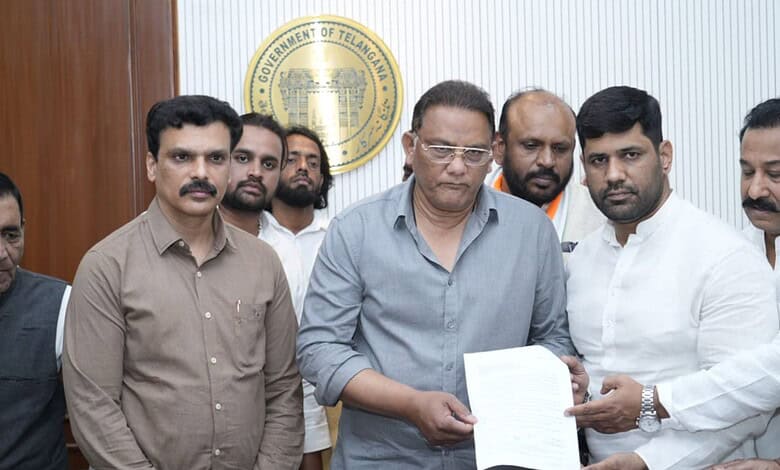 Officials review documents related to the delayed compensation process.