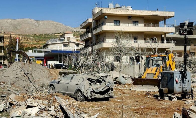 Bulldozer clearing debris near damaged buildings in Bednayel, Lebanon’s Bekaa Valley.