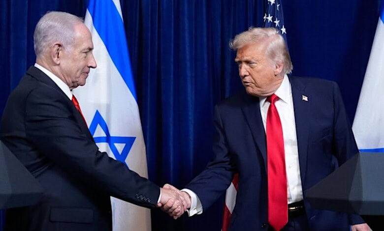 Israeli Prime Minister Benjamin Netanyahu and US President Donald Trump shake hands during a bilateral meeting, with Israeli and US flags in the background.