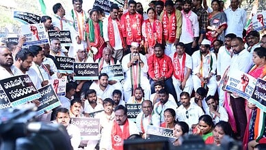 Protesters from Left and Congress parties gather during Bharat Bandh in Telangana. Demonstrators hol.