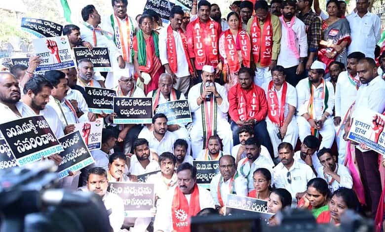 Protesters from Left and Congress parties gather during Bharat Bandh in Telangana. Demonstrators hol.