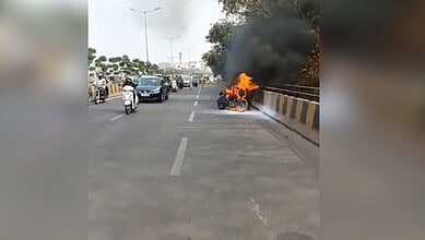 Image shows a bike in flames at the Durgam Cheruvu Cable Bridge