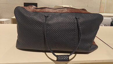 Black duffel bag suspected to contain illegal items seized at Bengaluru Airport.