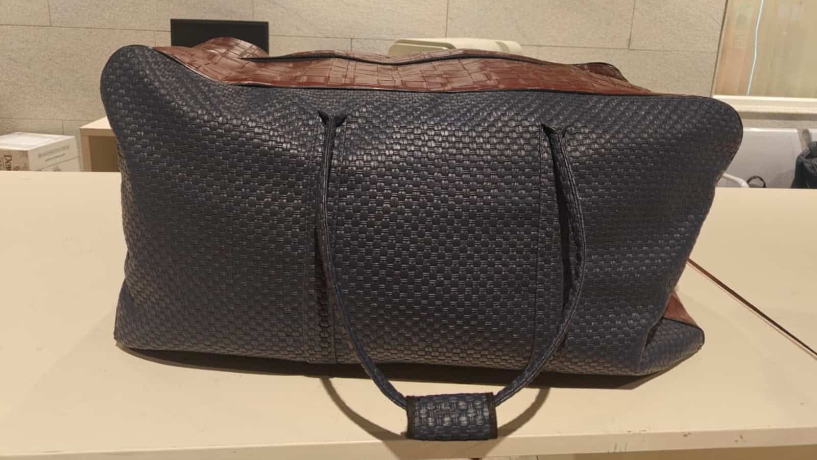 Black duffel bag suspected to contain illegal items seized at Bengaluru Airport.