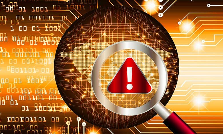 An image depicting a cybersecurity operation with a magnifying glass highlighting a warning symbol, representing a crackdown on cyber threats.