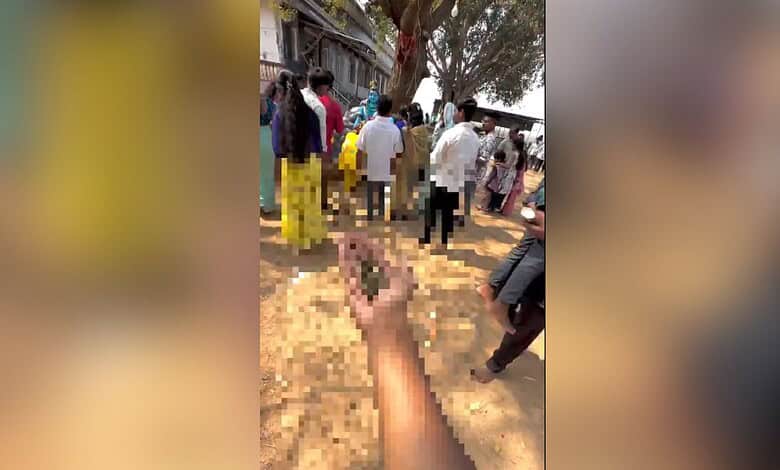 Image shows a blurred hand holding ganja infront of a Shiva idol in Hyderabad