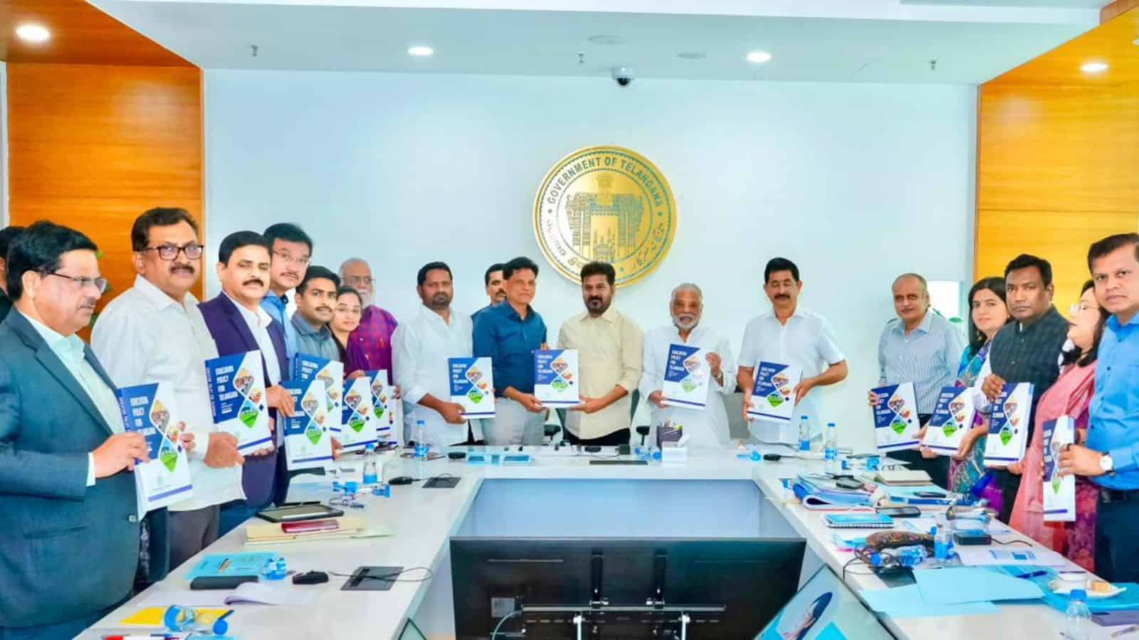 Group of officials at Telangana Education Board discussing education reforms.
