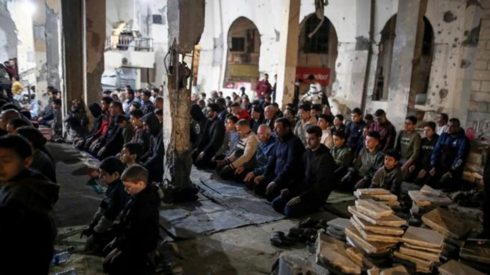 Palestinians pray during Taraweeh in Gaza after ceasefire, marking a significant moment in Ramadan 2.