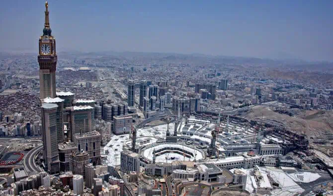 Aerial view of Makkah showing the clock tower and surrounding urban development.