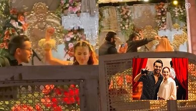 Hania Aamir and Asim Azhar dancing together at a wedding celebration.