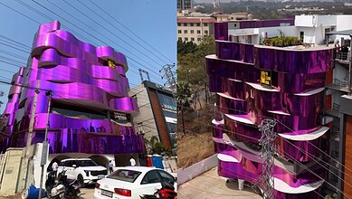 Colourful purple building with unique curved design in Hyderabad.