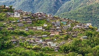Village community with hillside houses in India, showcasing honesty and simplicity in a secure environmen.