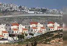 Israeli settlement Neve Yaakov near East Jerusalem, with separation wall dividing Palestinian area in the West Bank.